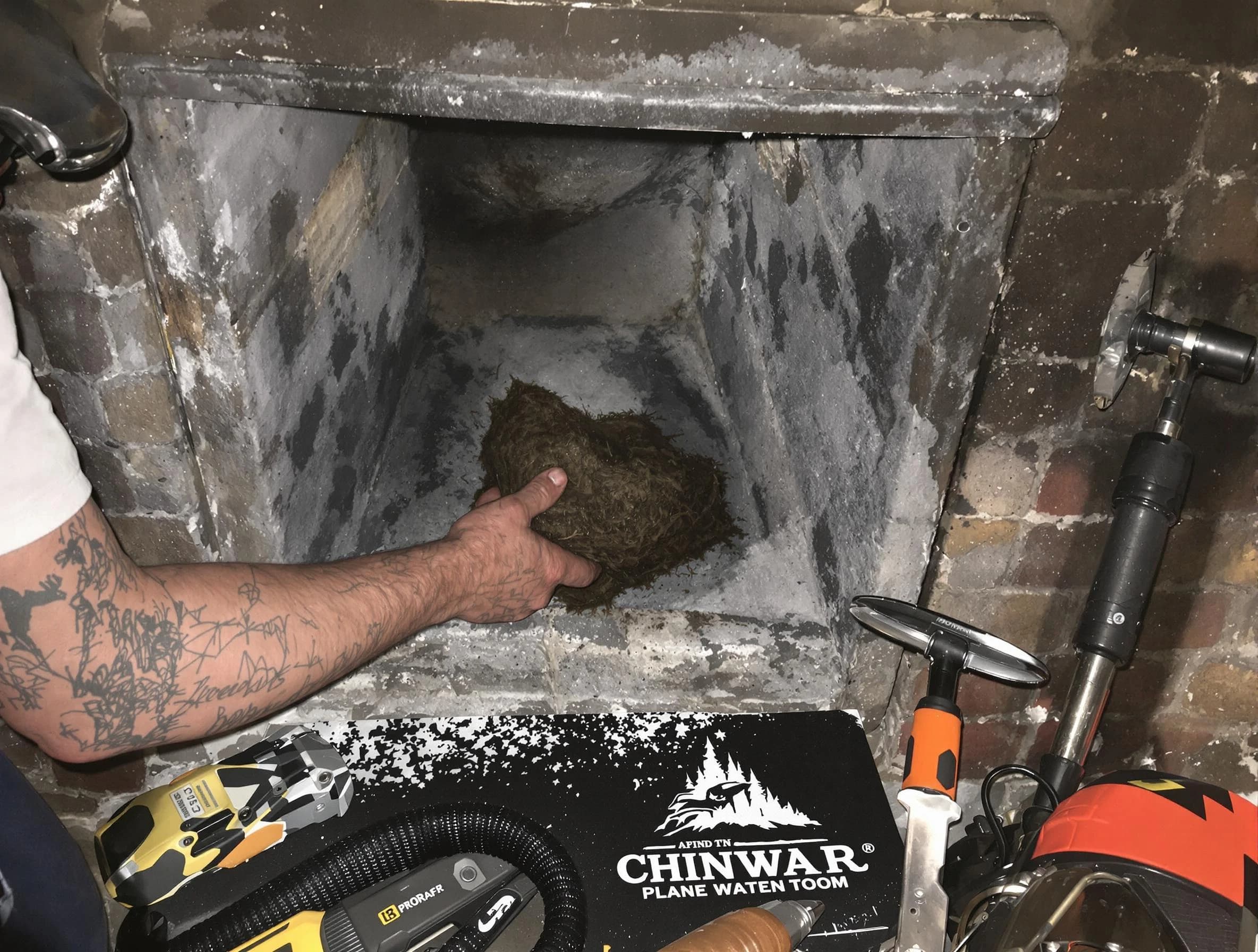 Staten Island Chimney Sweep safely removing debris and screening chimney in Staten Island, NY